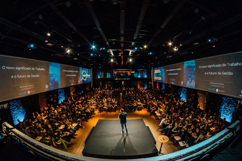Speaker addressing a business conference audience