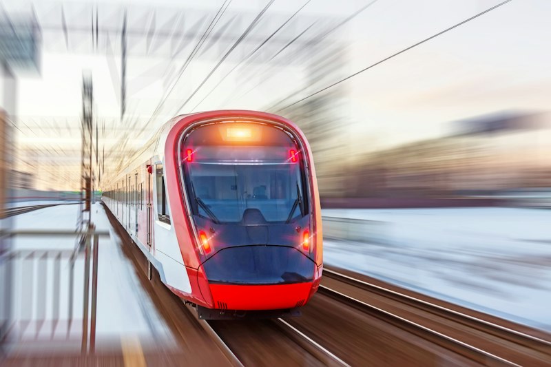 Modern high-speed train in motion, representing Etihad Rail's new Dubai-Abu Dhabi passenger service