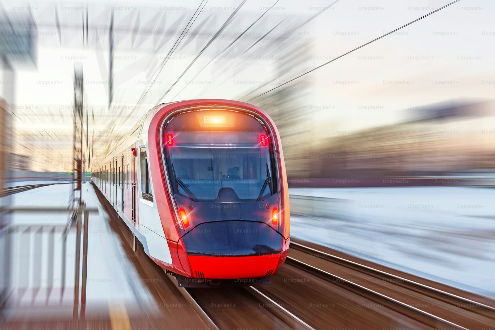 Modern high-speed train in motion, representing Etihad Rail's new Dubai-Abu Dhabi passenger service