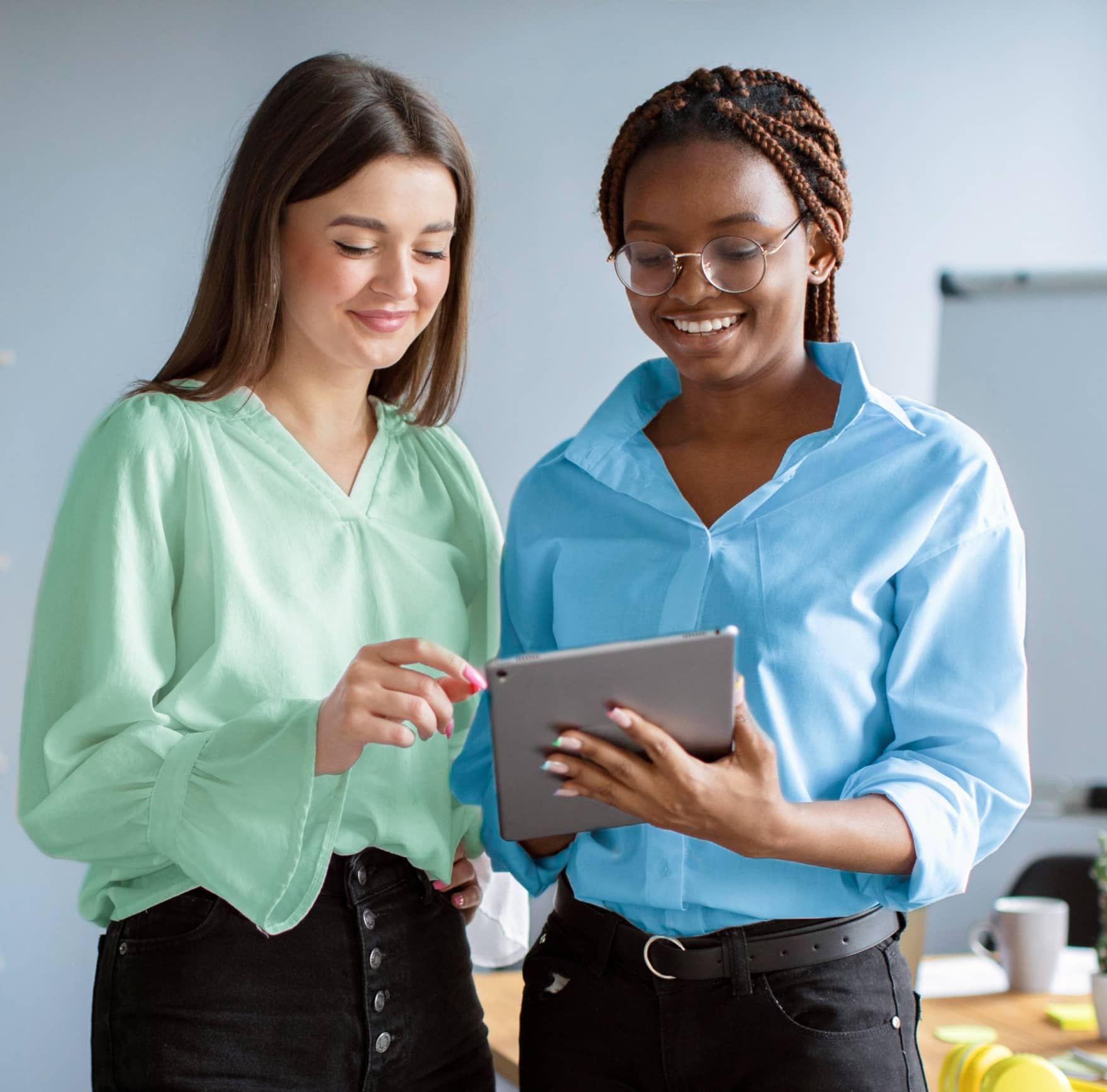 Women Friends Looking at a Tablet - Saasfy X Webflow Template
