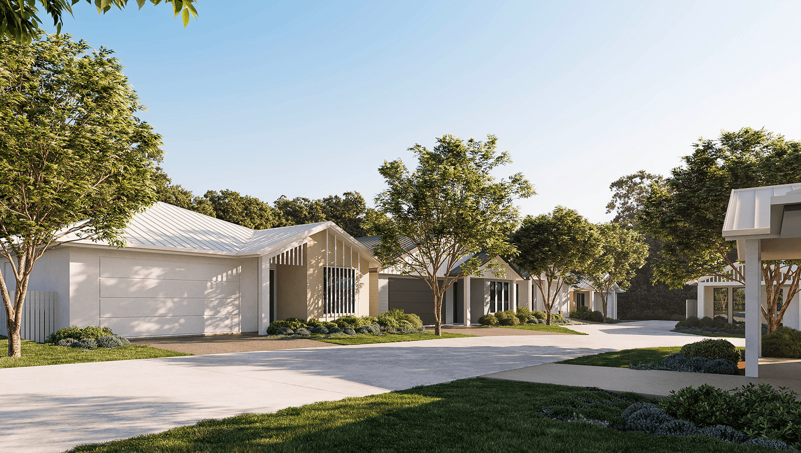 Modern single-story houses with metal roofs along a tree-lined street under a clear blue sky.