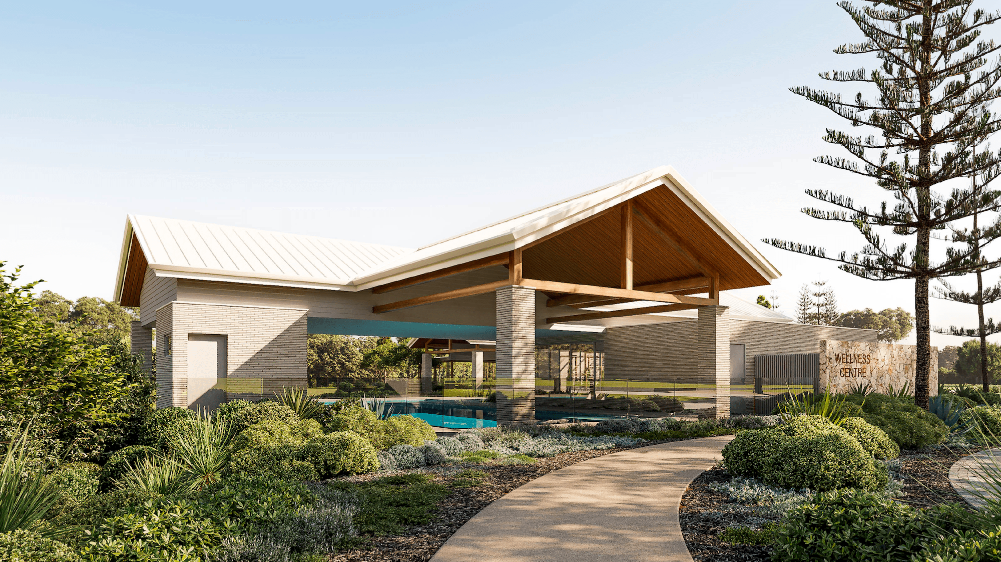 Modern wellness centre building with pitched roof, glass fenced pool, and surrounding landscaped greenery.