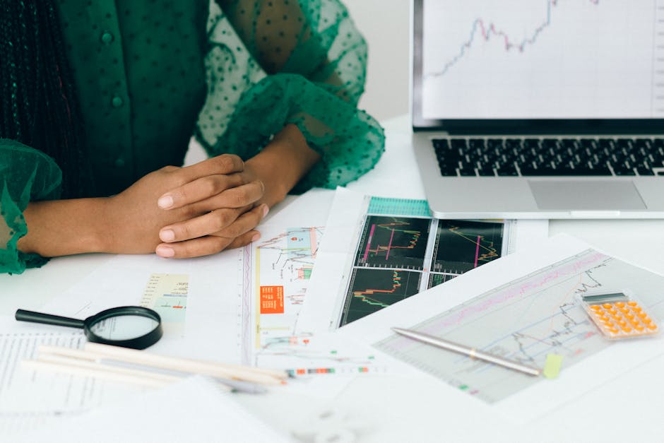 person updating financial model on laptop - saas financial model template person updating financial model on laptop - saas financial model template