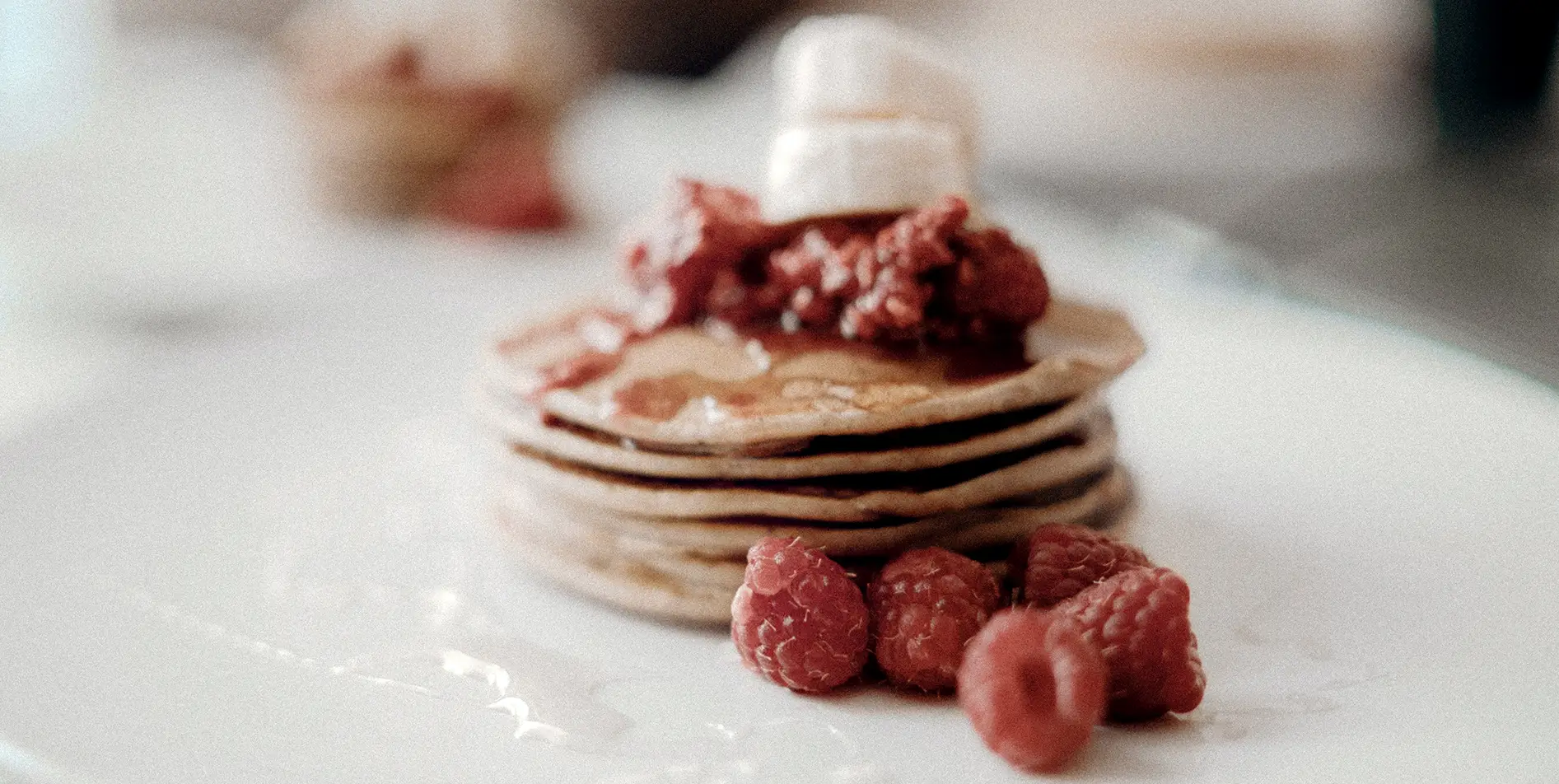 Indulgent pancakes with red berries, 4-star breakfast service in the heart of nature.