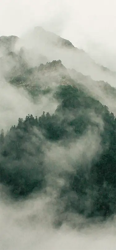 Swiss alpine peak shrouded in mist, an exclusive and poetic interlude offered by SNUUG.