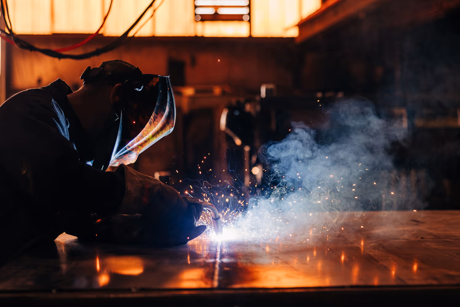 Welder welds a Stone Valley Container
