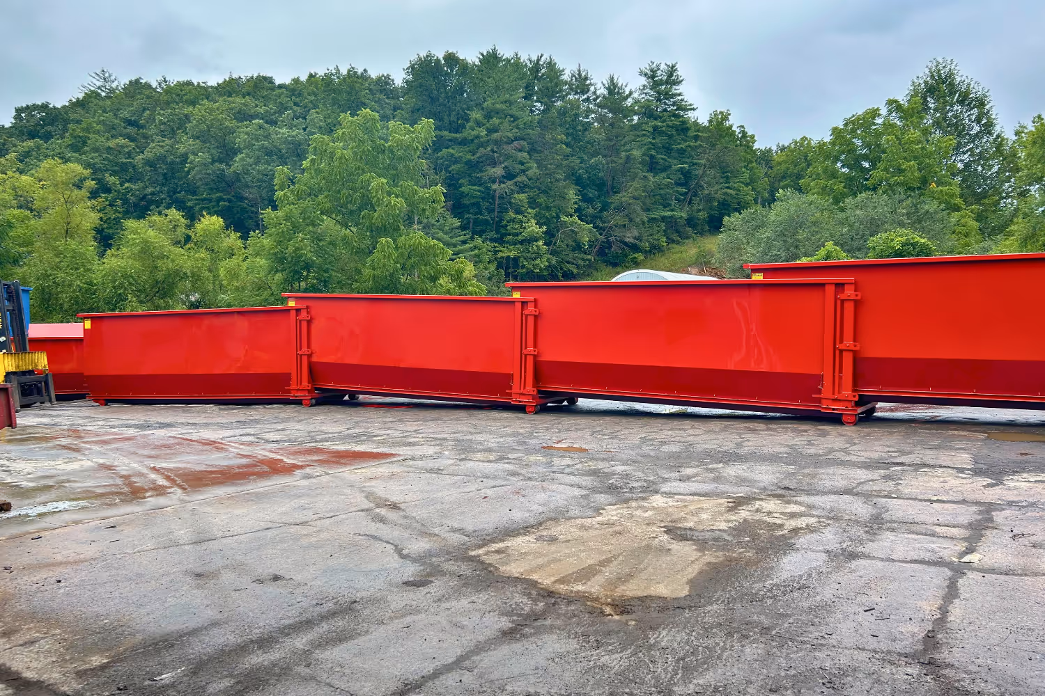 Roll-off containers stacked into each other