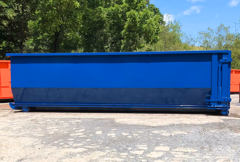 A blue roll-off container
