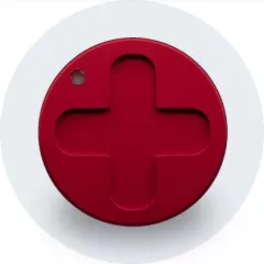 A red plastic button with a cross on it