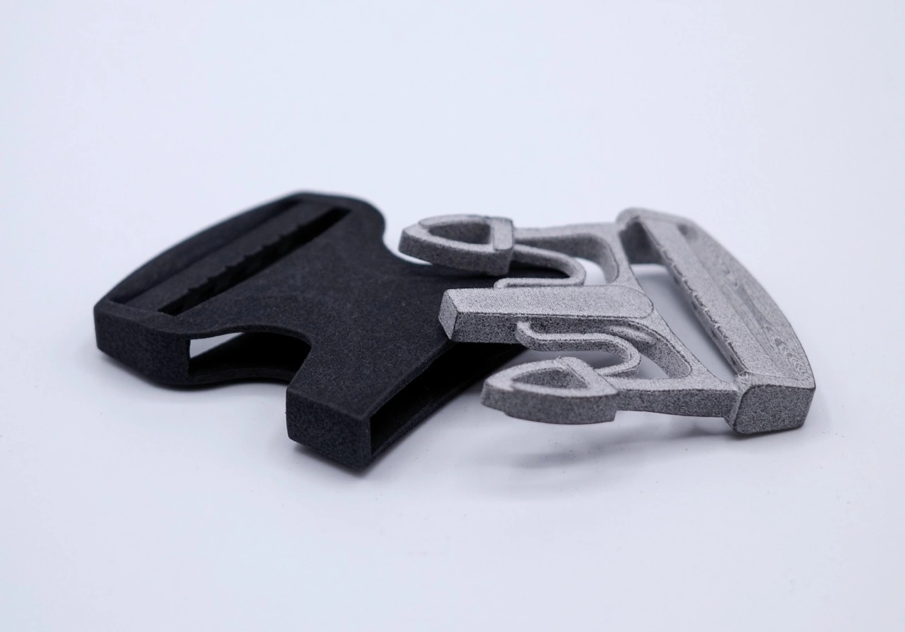 A pair of black and silver scissors on a white surface