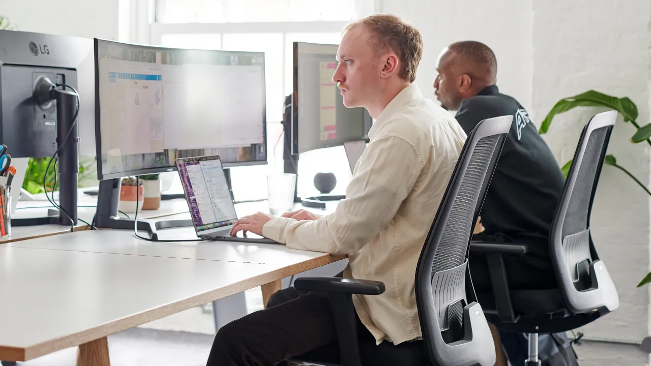 men working on a computer