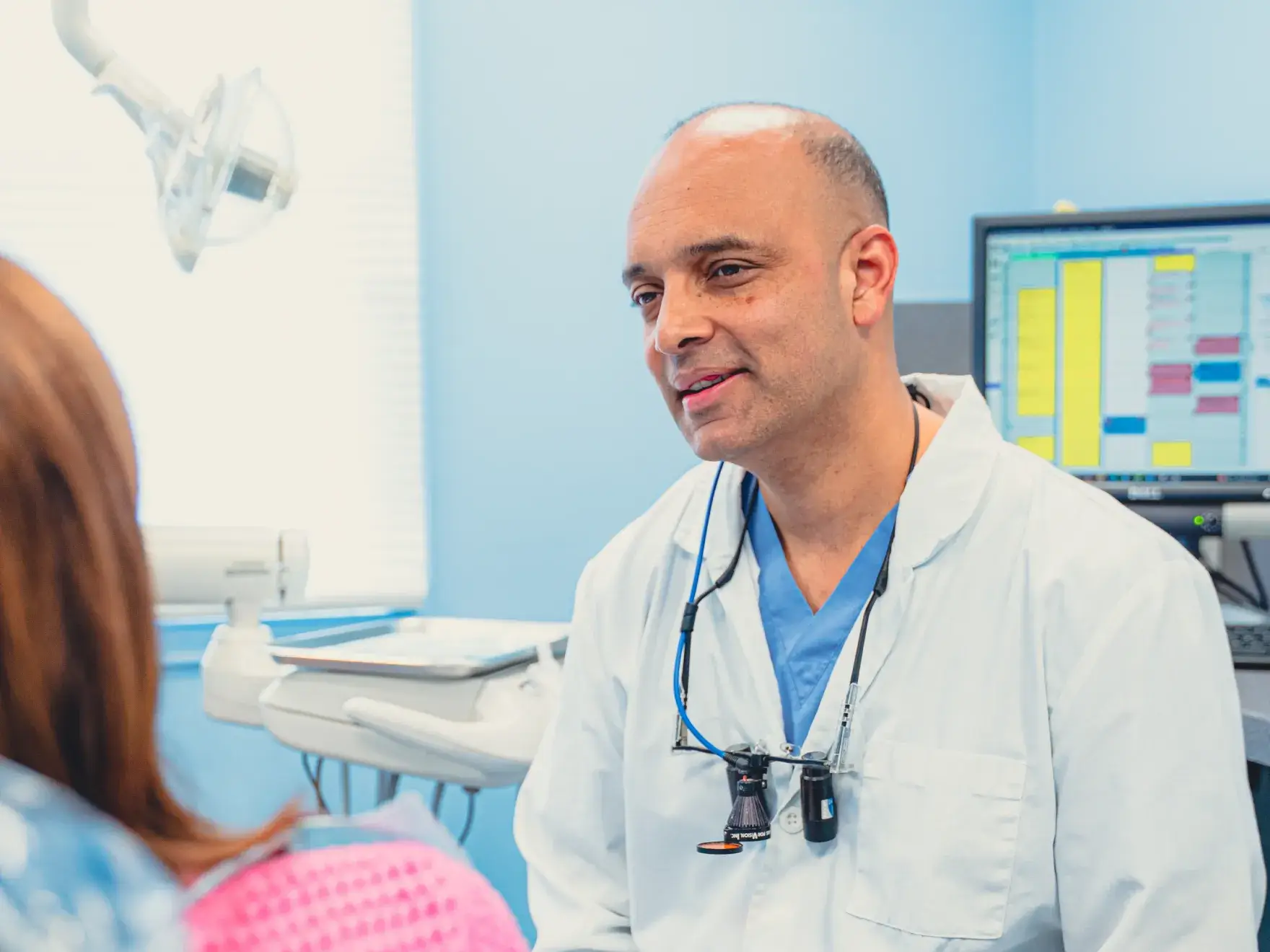 Dr. Cherian talking to patient