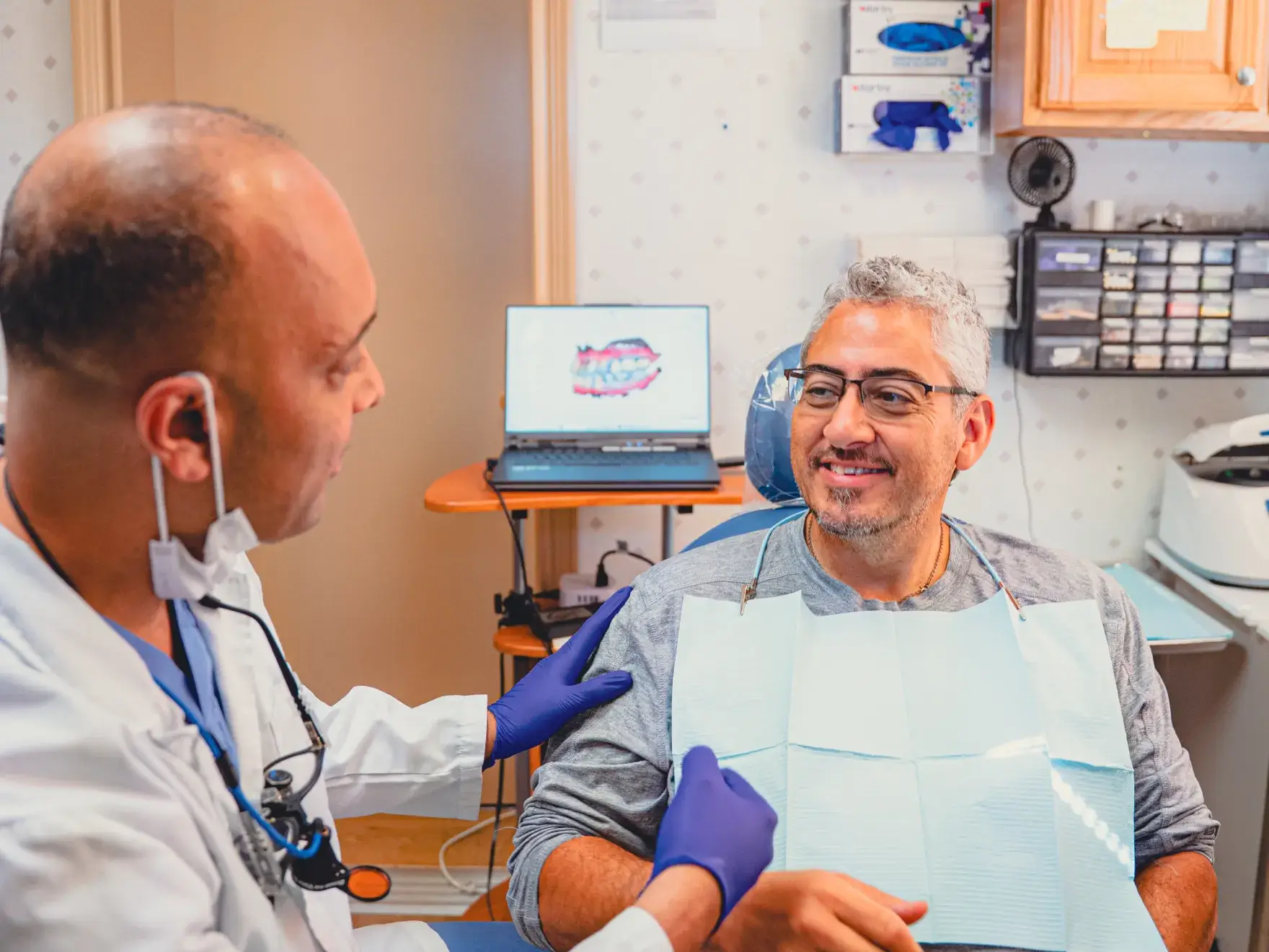 Dr. Cherian talking to patient