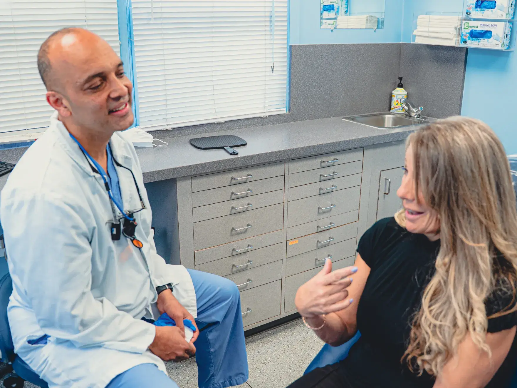 Dr. Cherian talking to patient