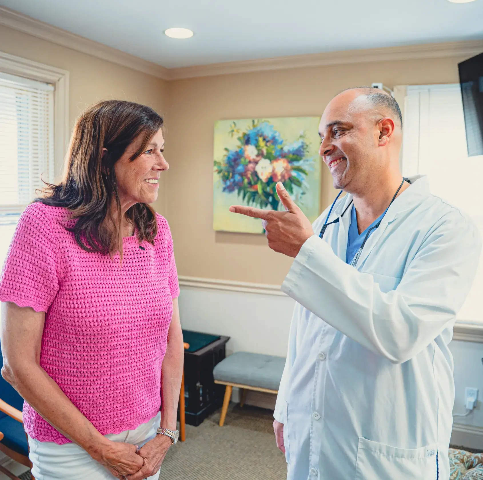 Dr. Cherian talking to patient
