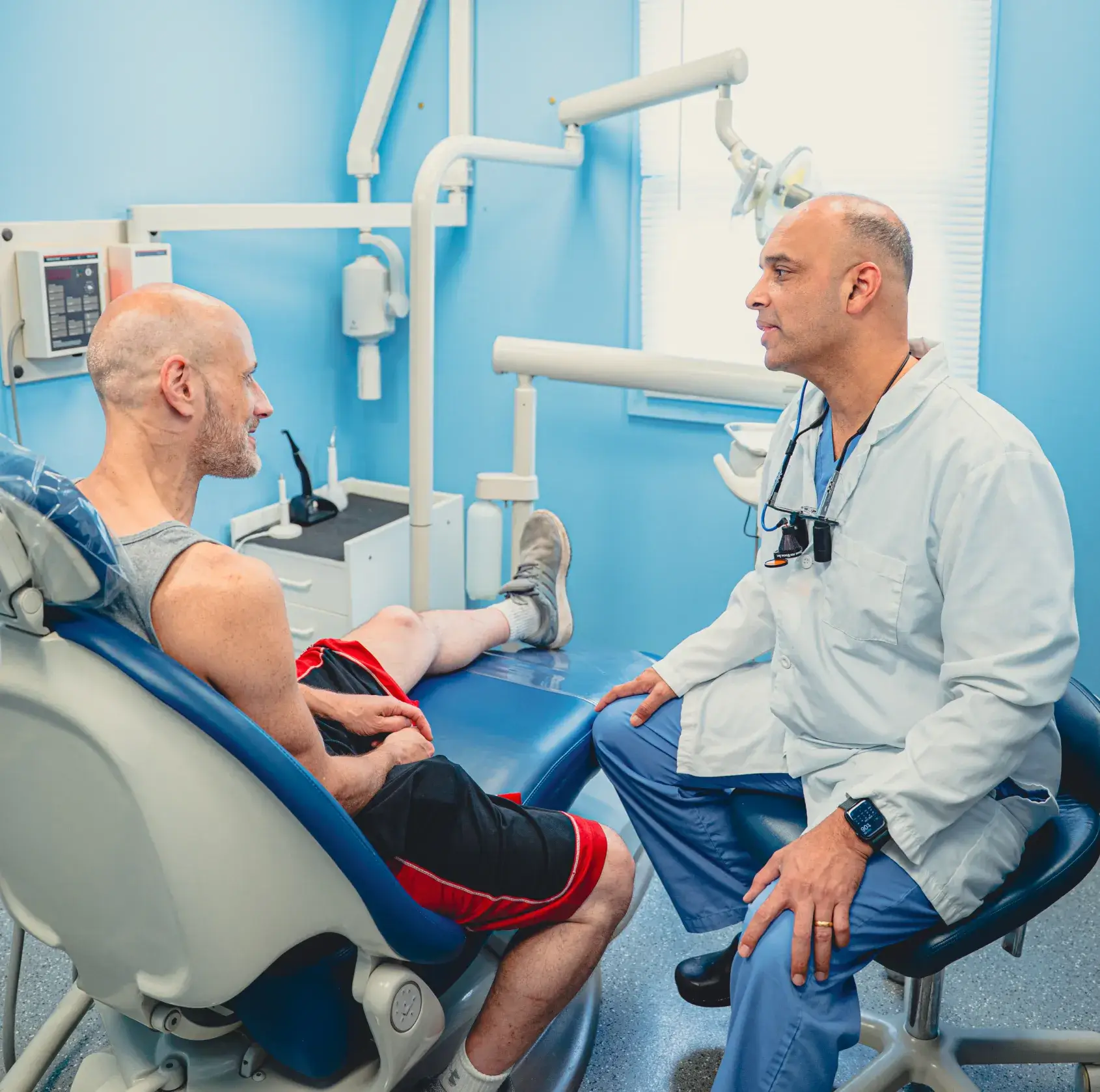 Dr. Cherian talking to patient