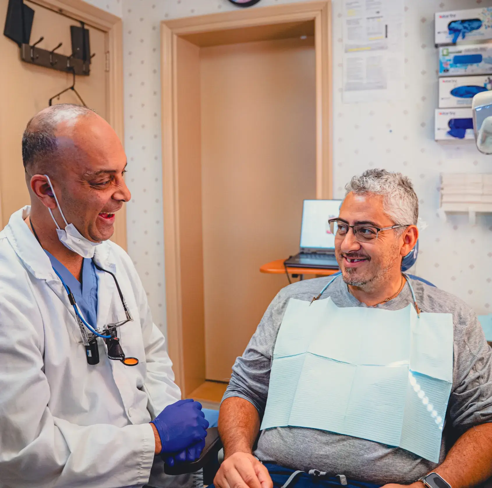 Dr. Cherian talking to patient