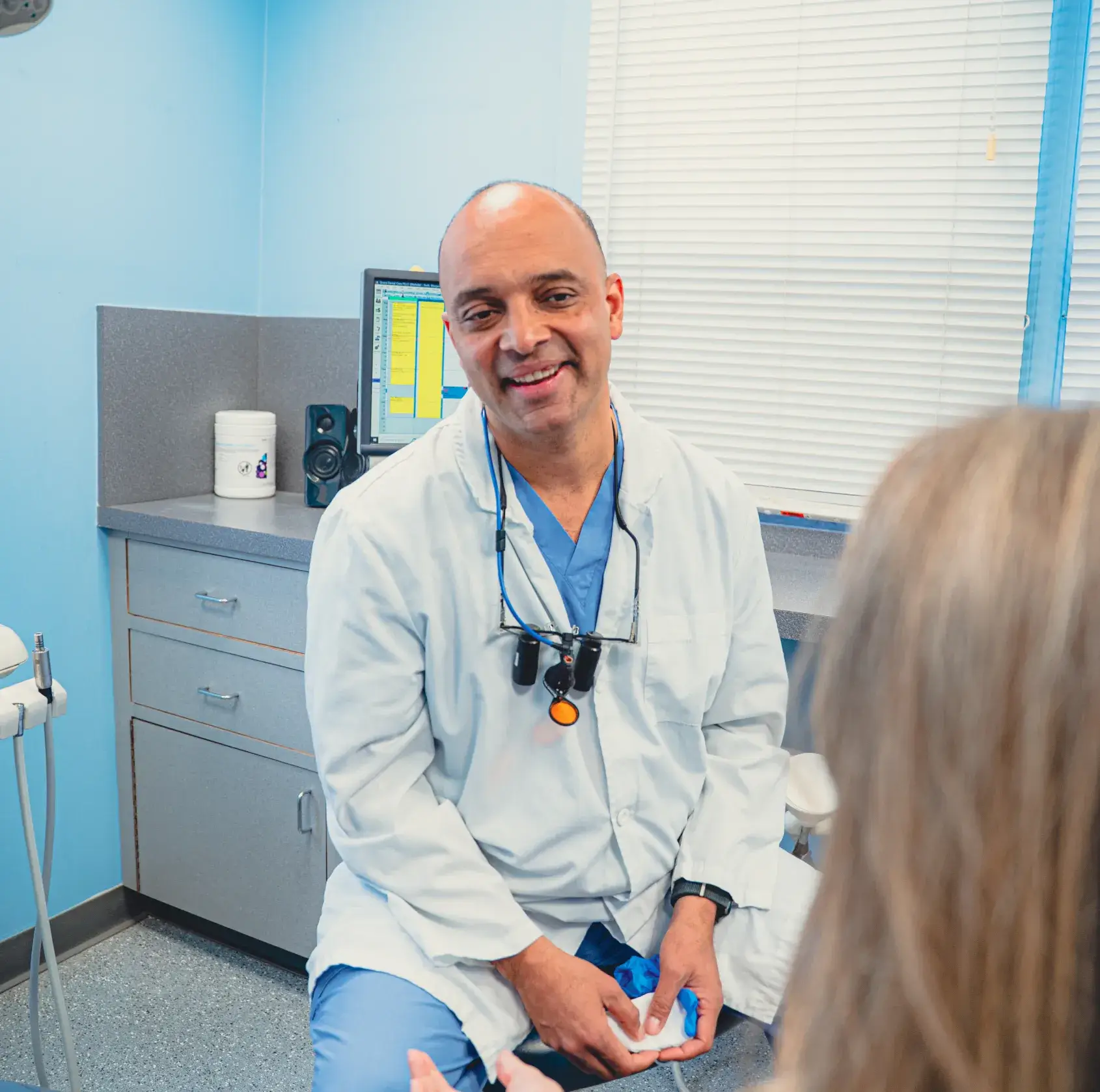 Dr. Cherian talking to patient