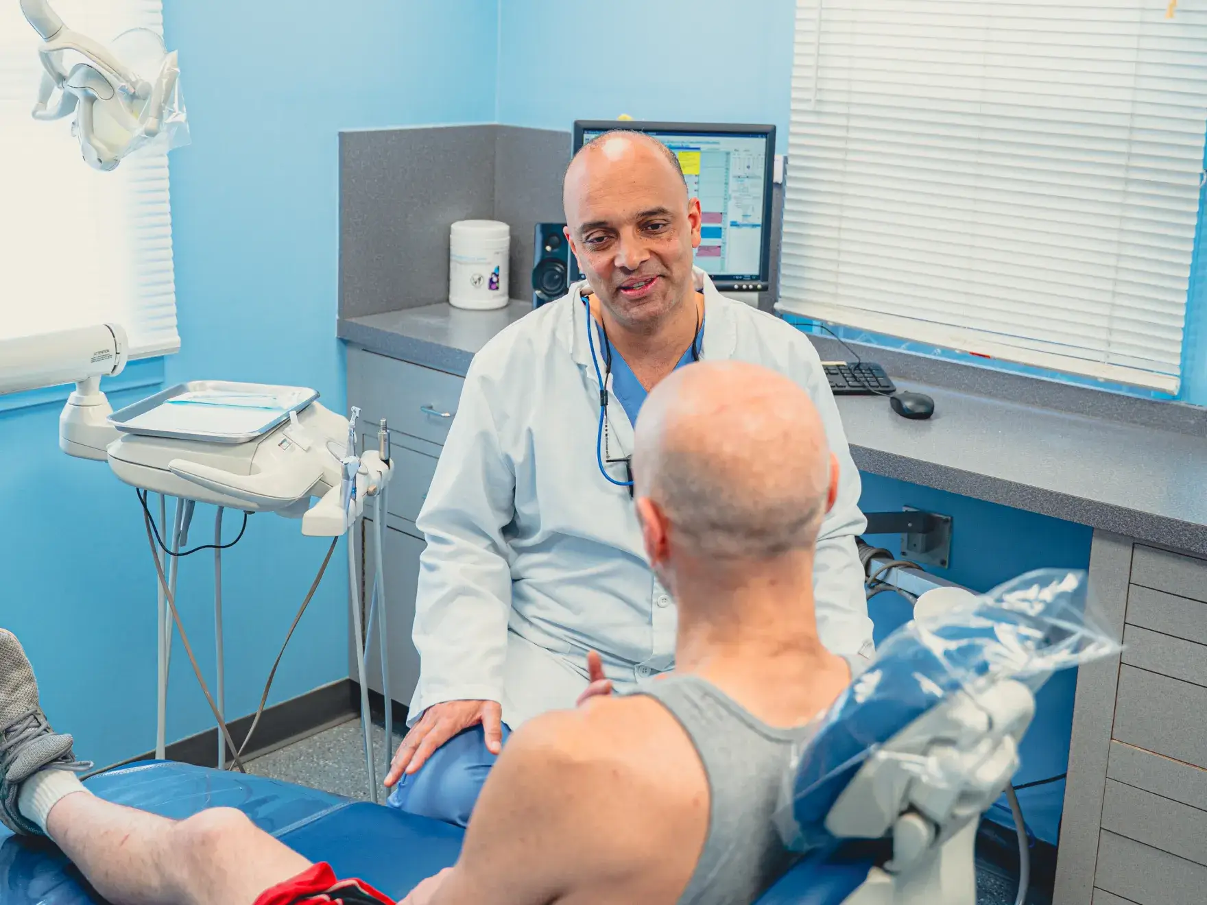 Dr. Cherian talking to patient
