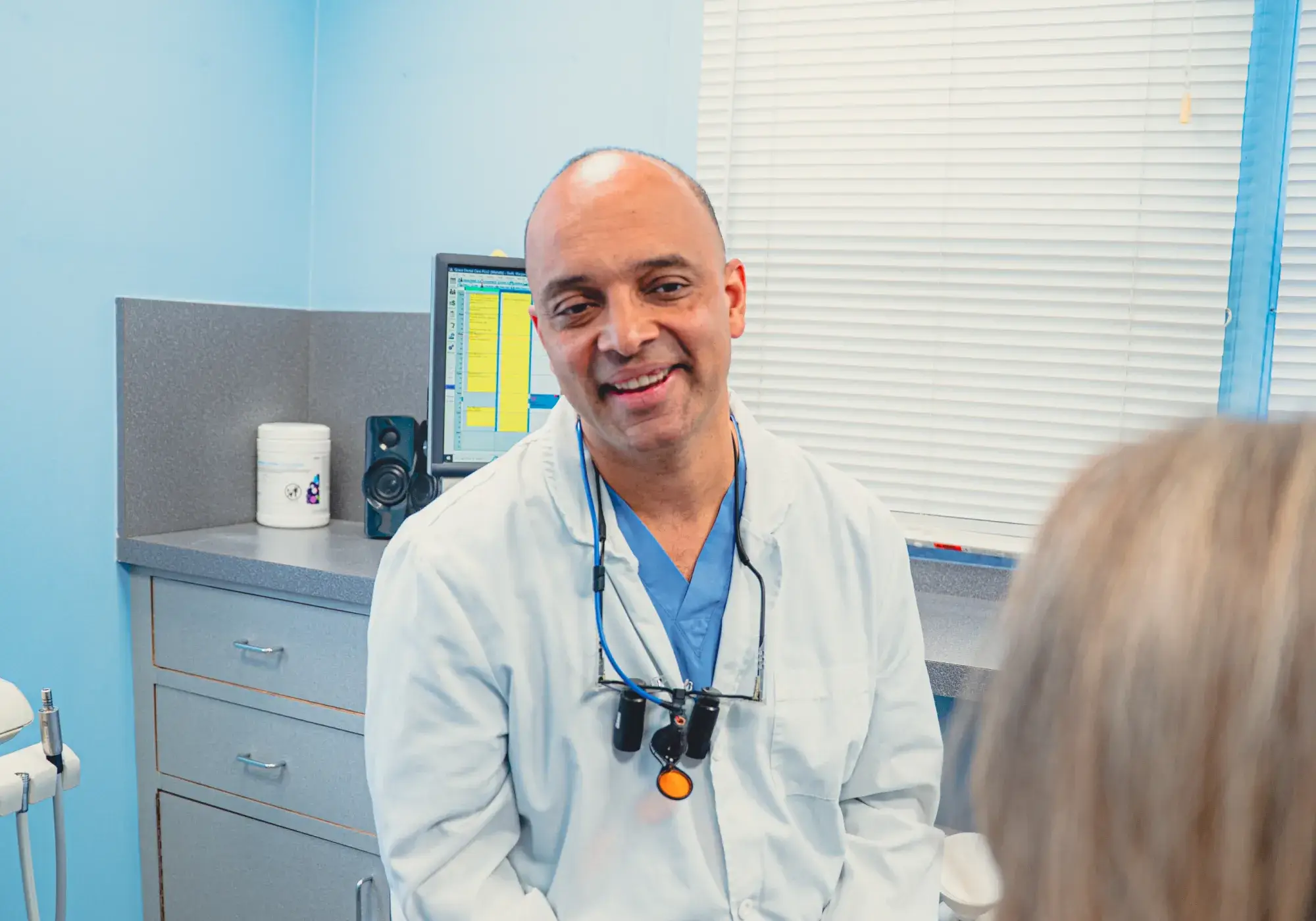 Dr. Cherian talking to patient