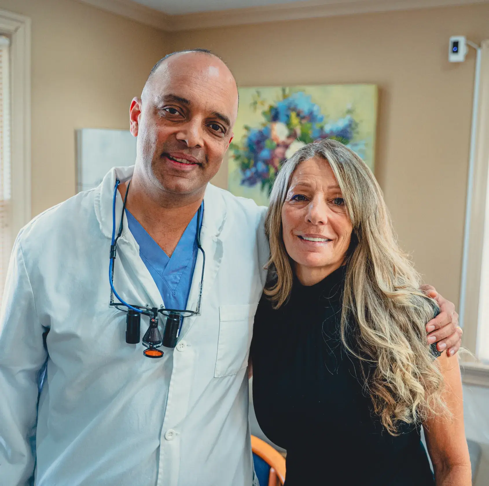 Dr. Cherian hugging patient
