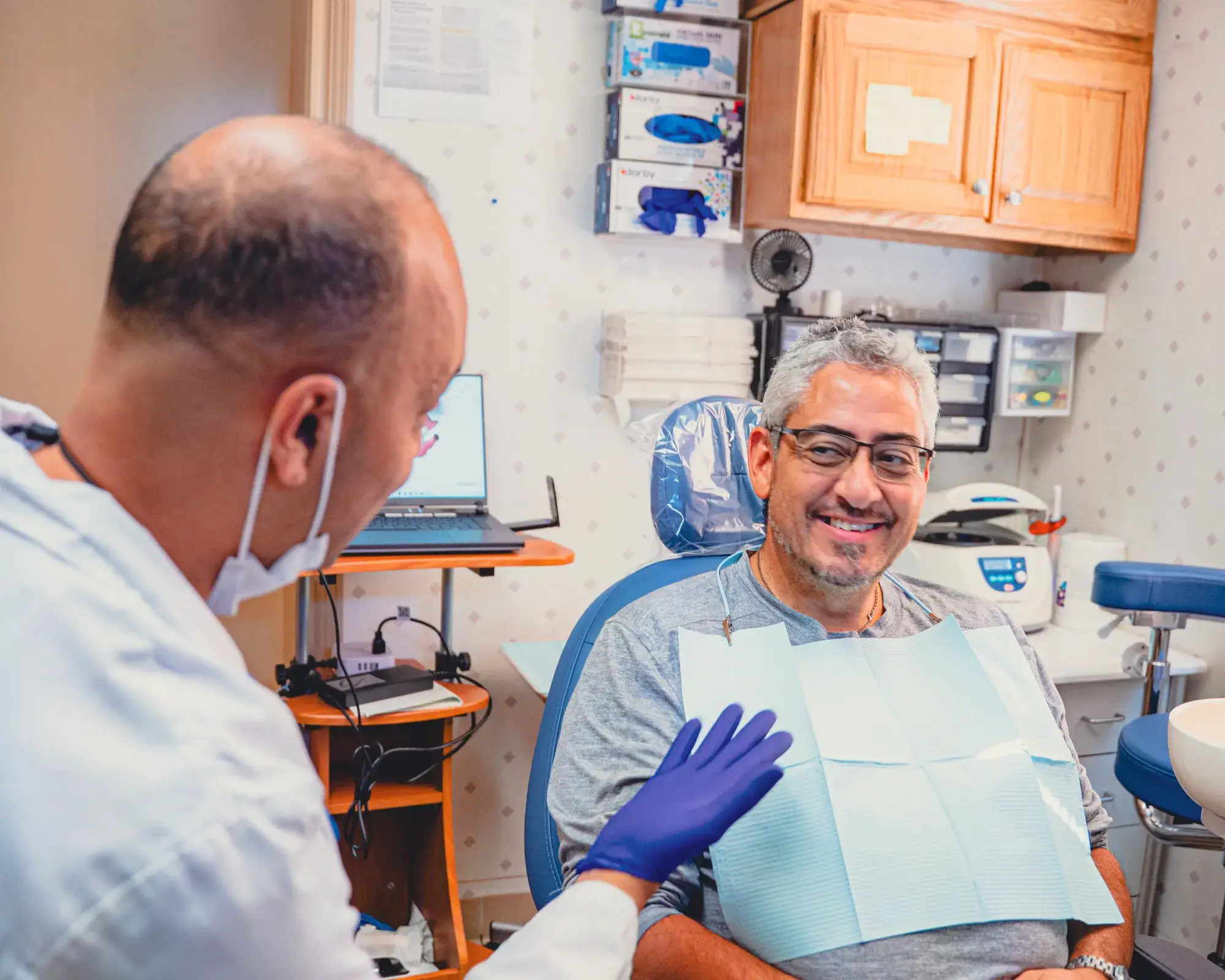 Dr. Cherian talking to patient