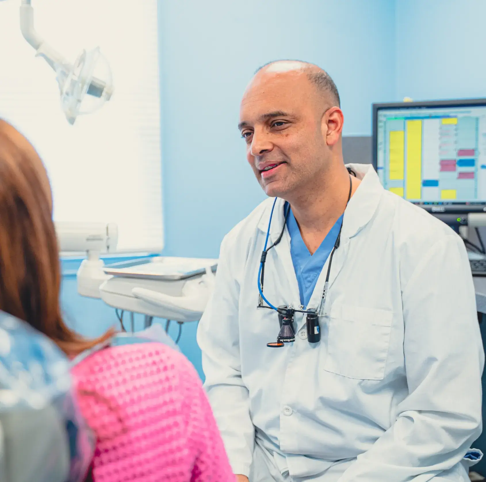 Dr. Cherian talking to patient