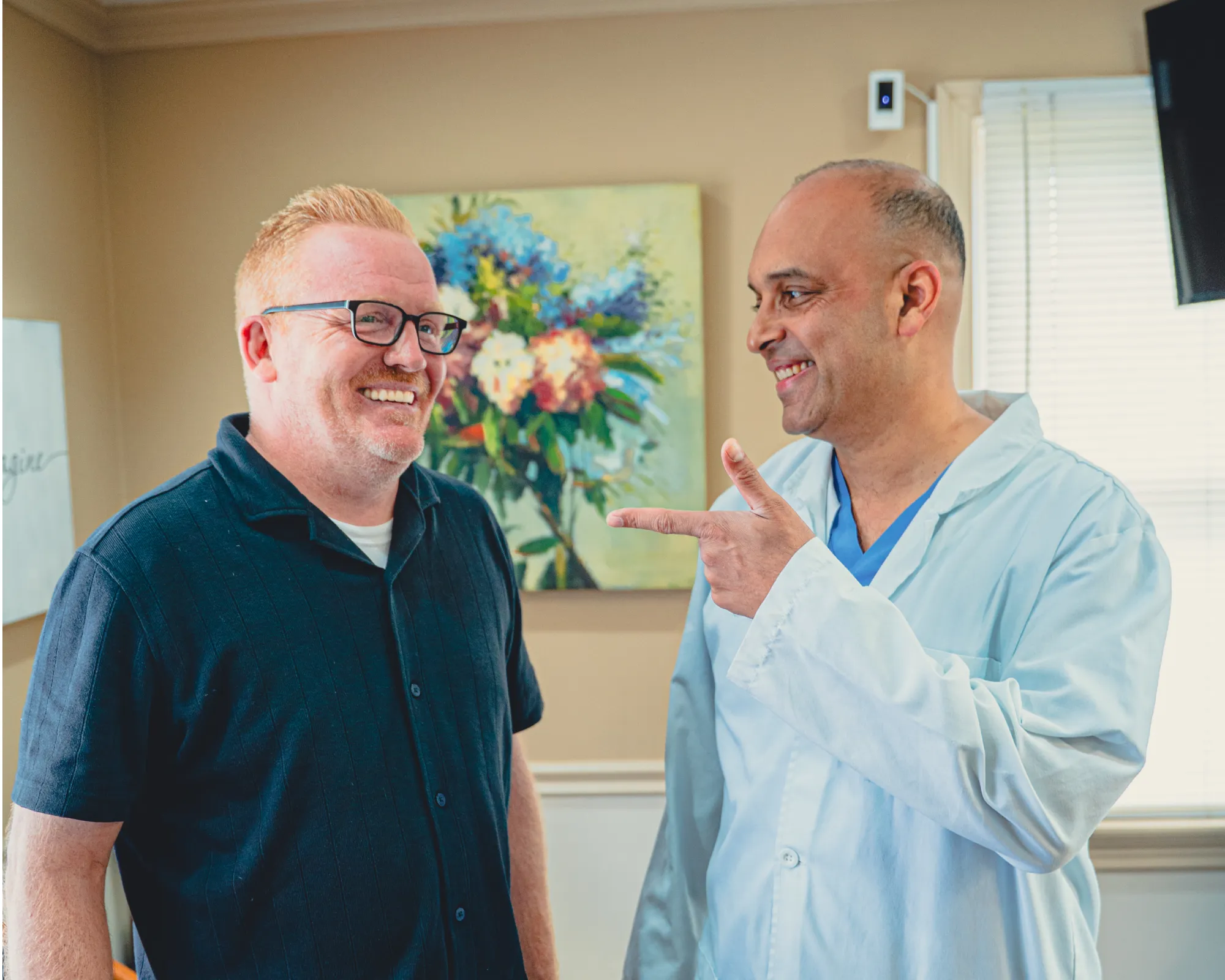 Dr. Cherian talking to patient