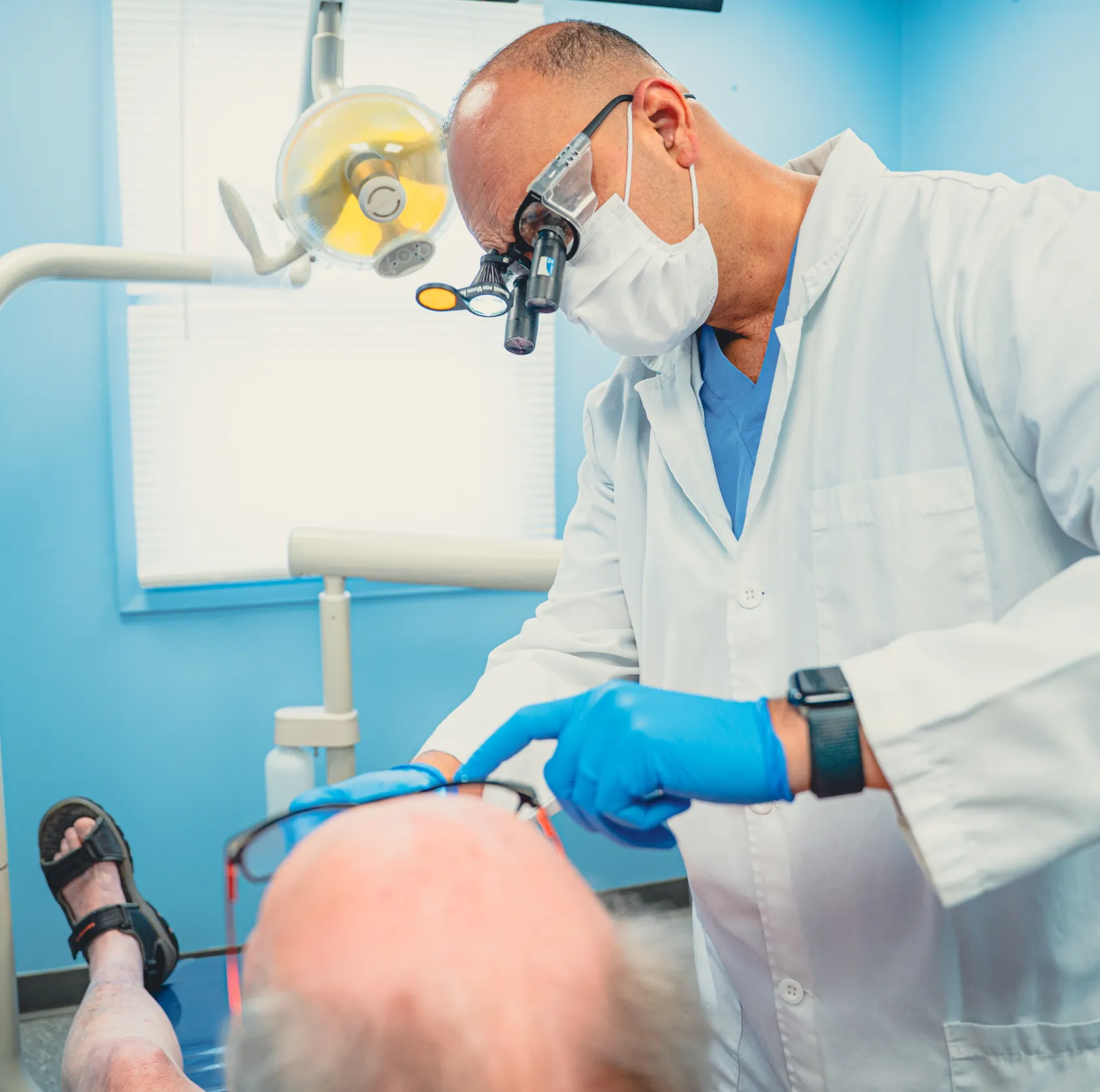 Dr. Cherian checking patient