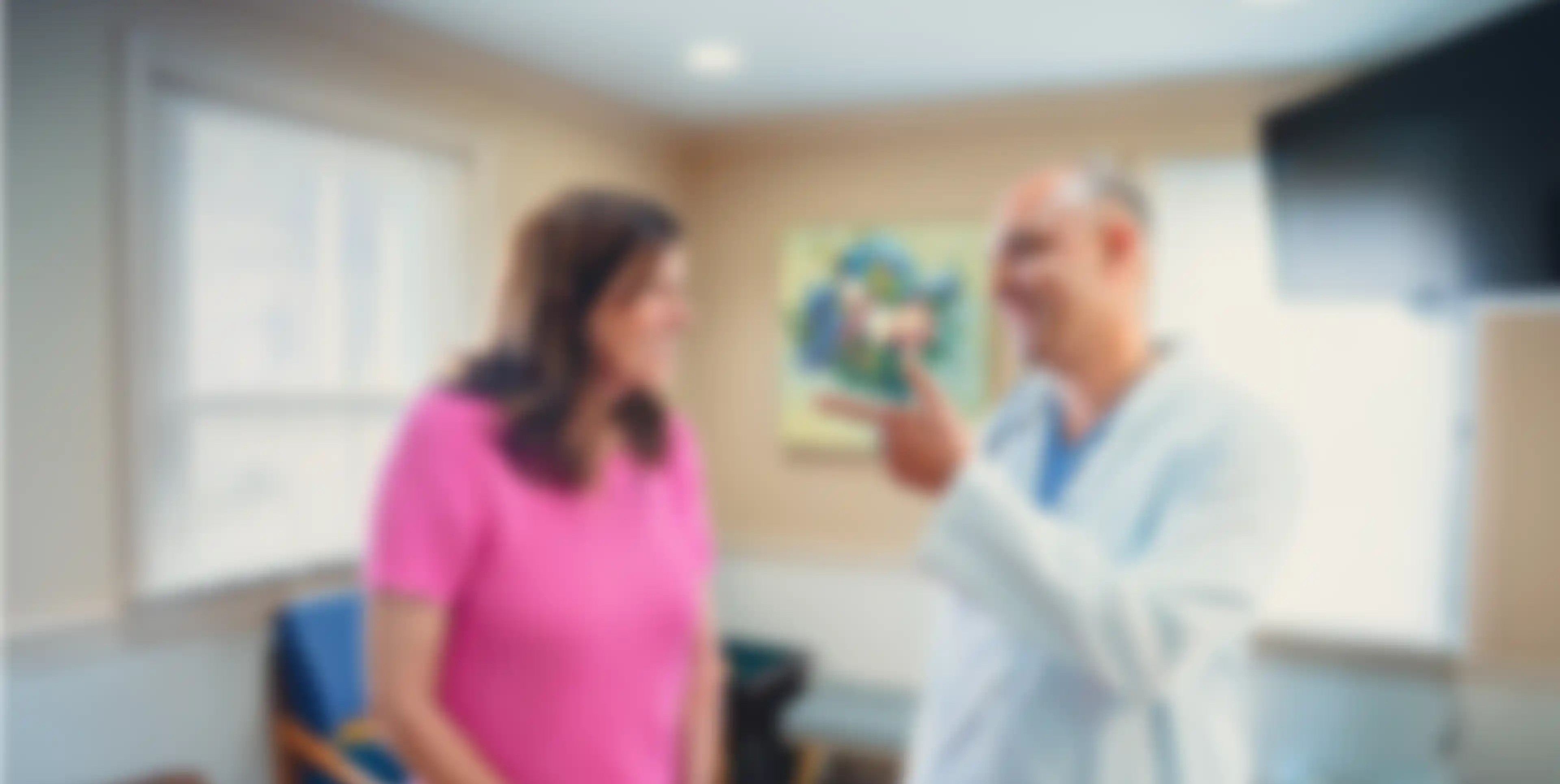 Dr. Cherian talking to patient
