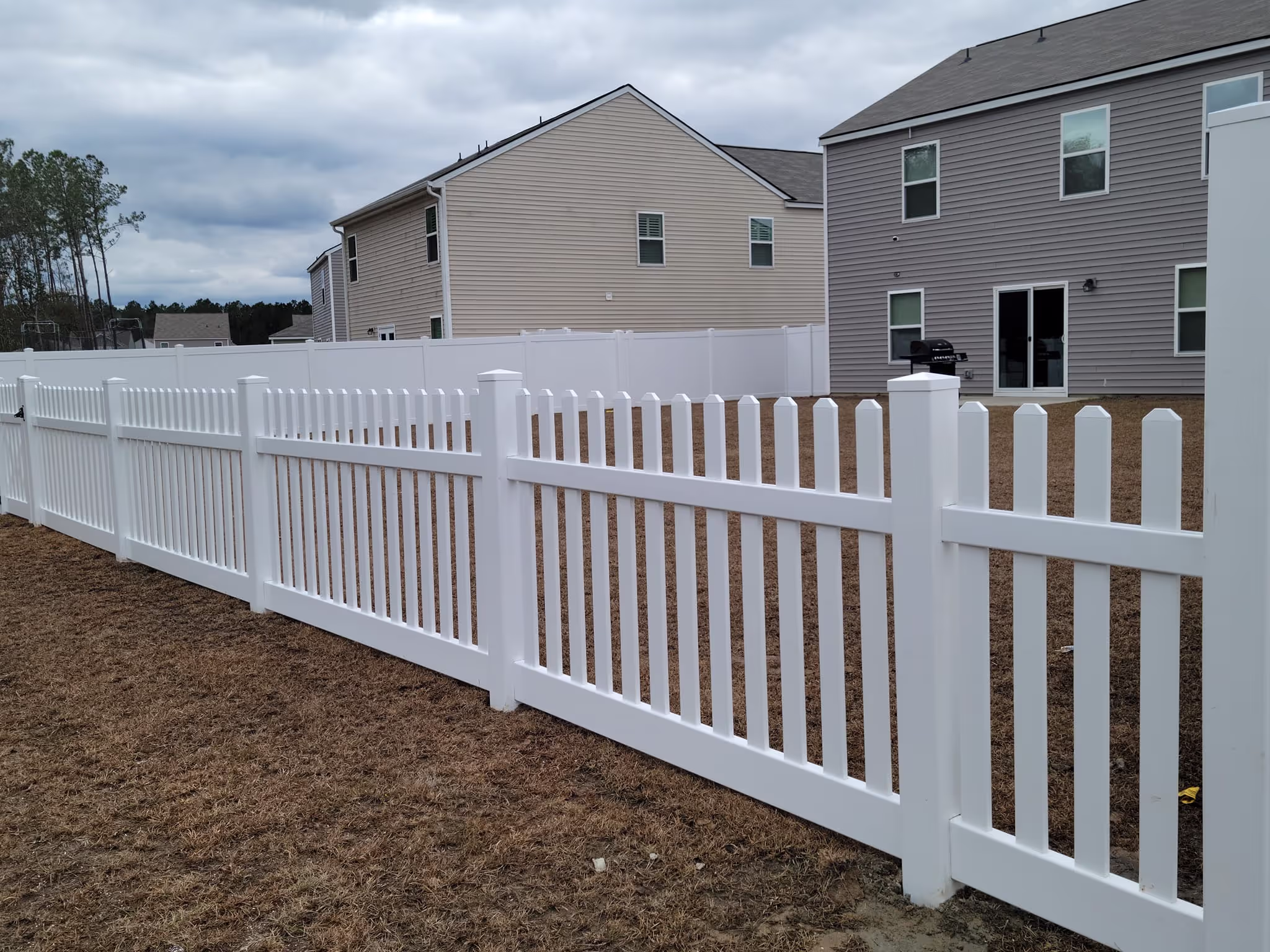 Aluminum fence along green lawn