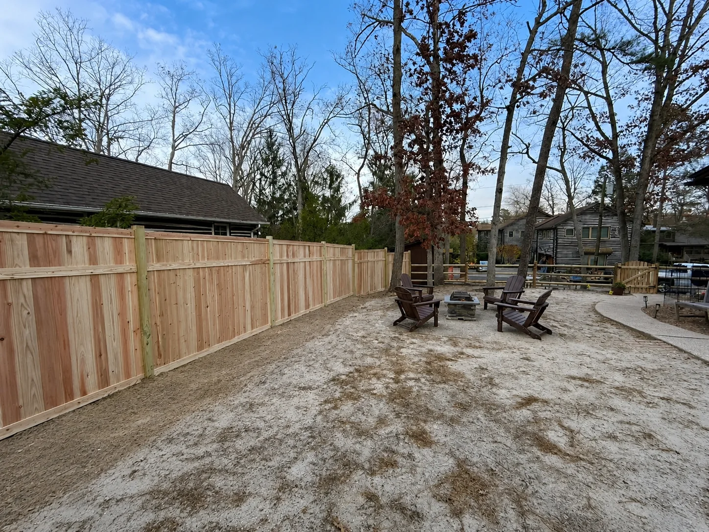 Wood privacy fence bordering a backyard seating area in Chester County, PA.
