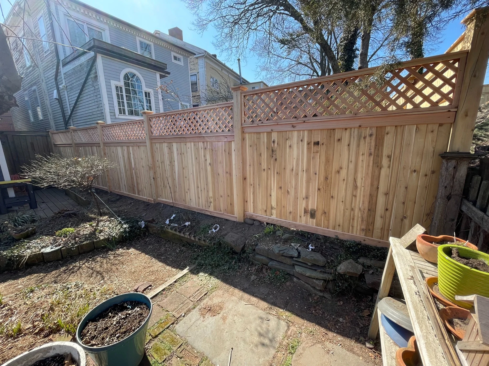 Cedar privacy fence with lattice top enclosing a residential backyard in Wilmington, DE.