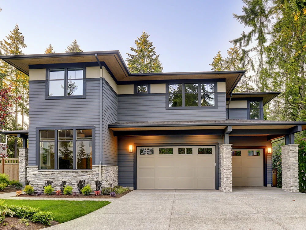 A modern, beautiful home with nice siding on it.