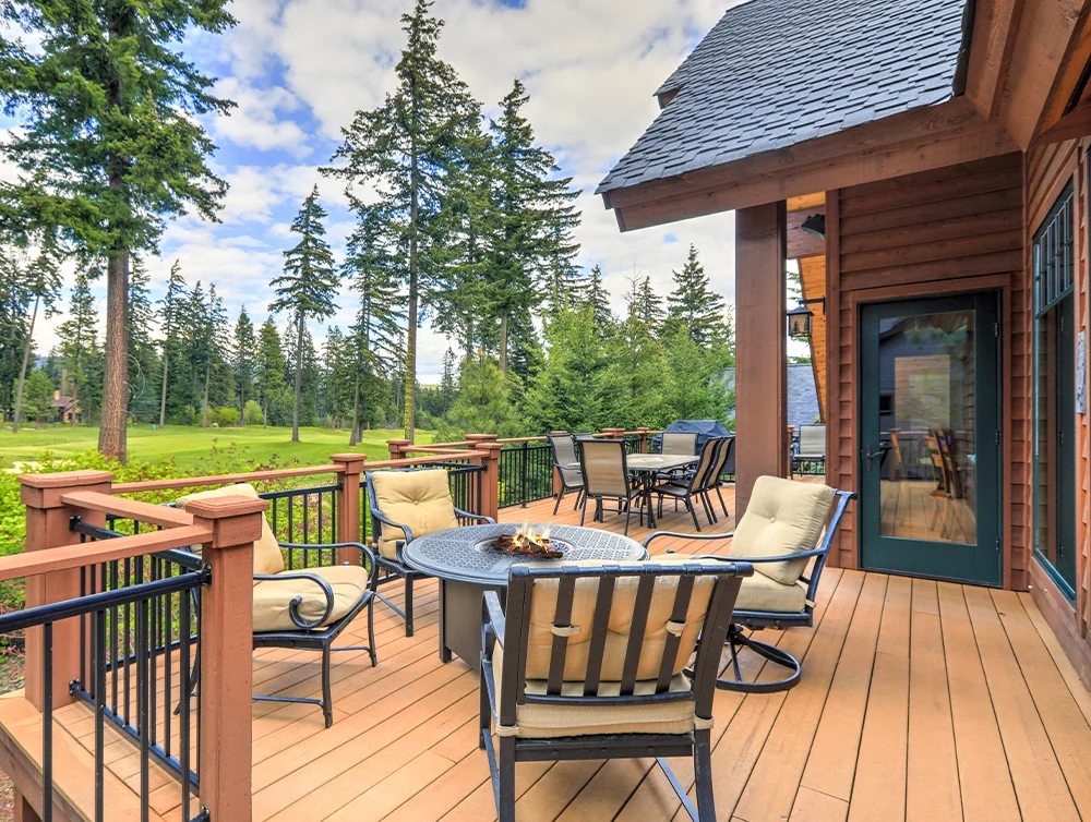 Cozy deck of a house with golf course in the back yard.