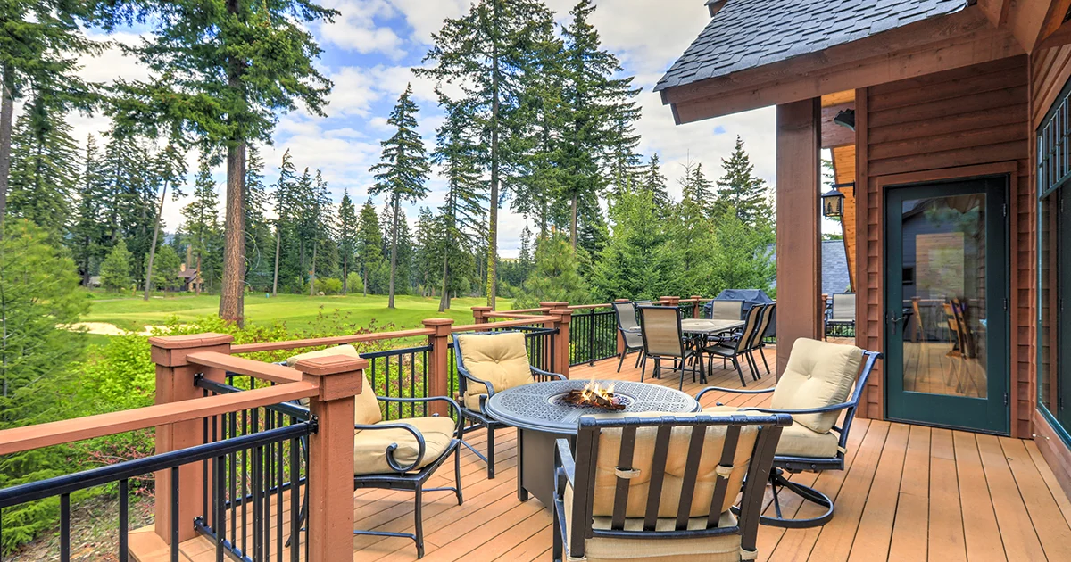 Cozy deck of a house with golf course in the back yard.