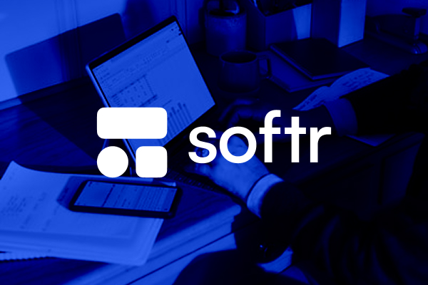 Softr monochrome logo placed on a busy photographic background — example of correct usage when colour clashes with the underlying scene