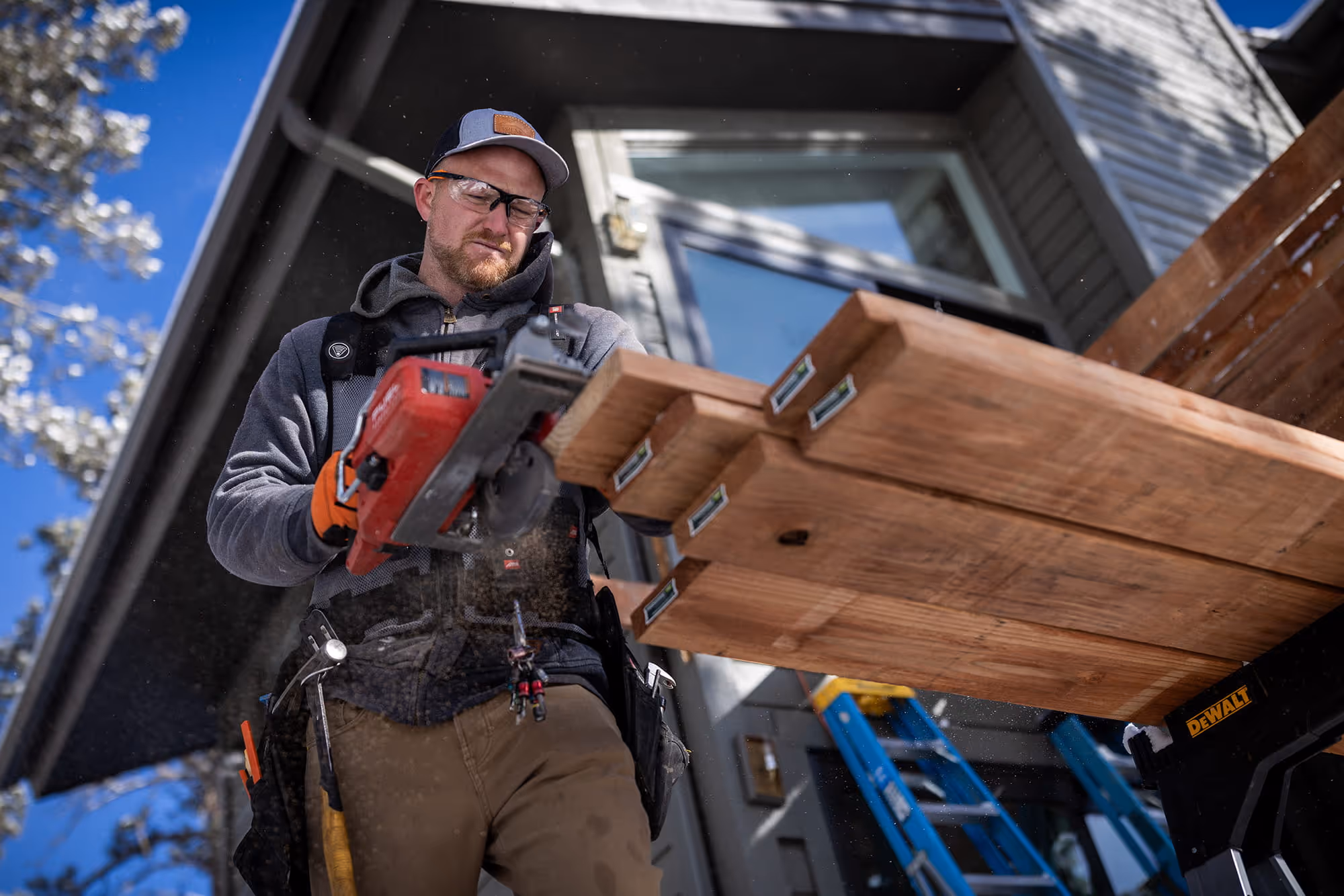 Person cutting TrueFrame Joists with circular saw.