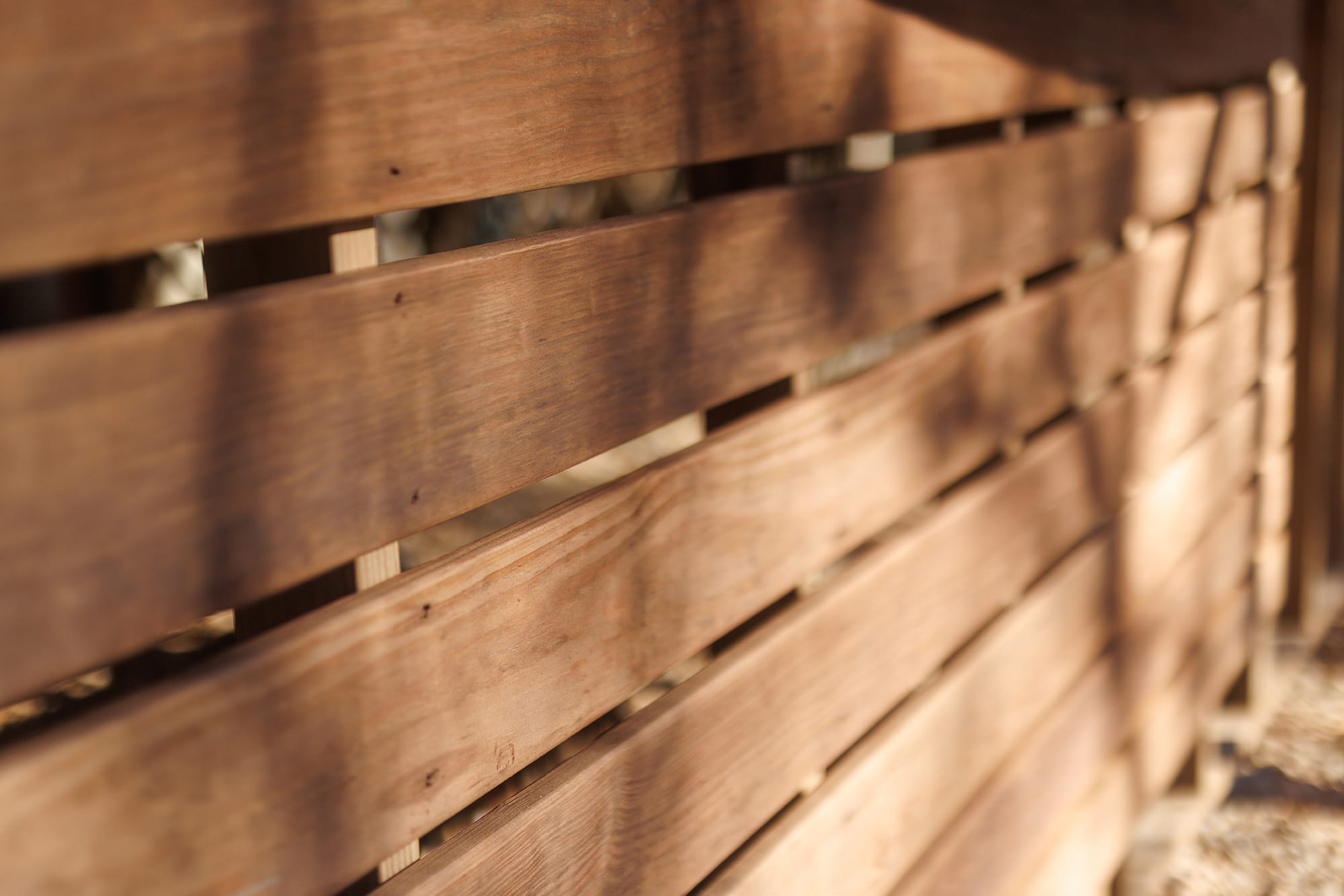 An underdeck enclosure made out of color treated deck boards.