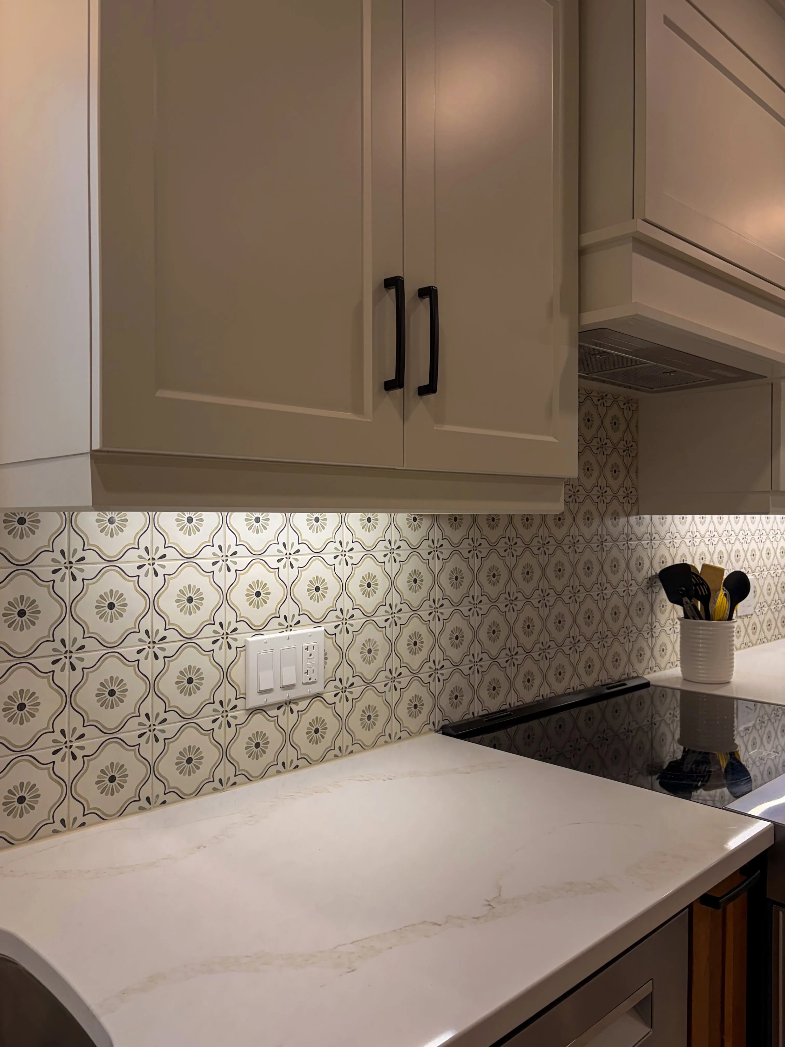 Patterned tile backsplash installed by Master Flooring in a Cambridge kitchen
