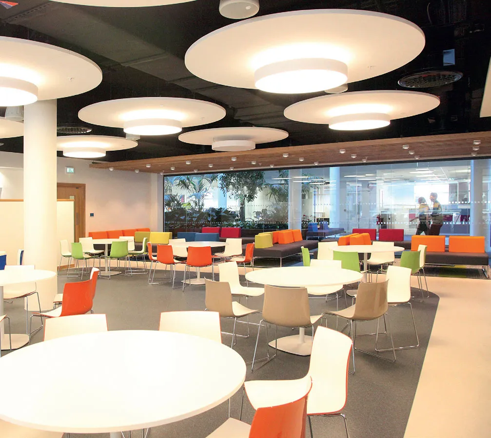 Polyflor flooring in a bright commercial workplace dining area