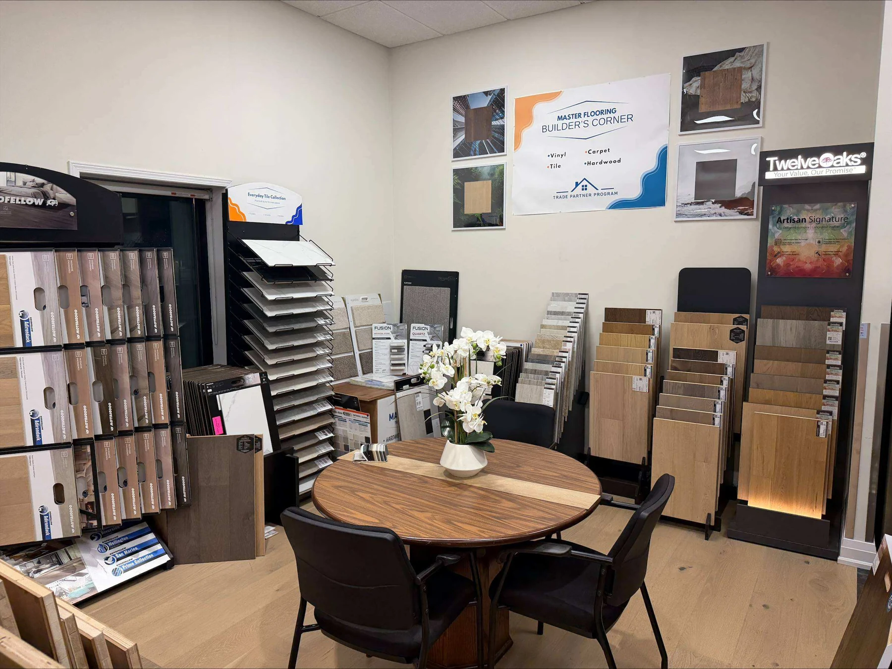 Consultation table surrounded by flooring samples in the Master Flooring showroom
