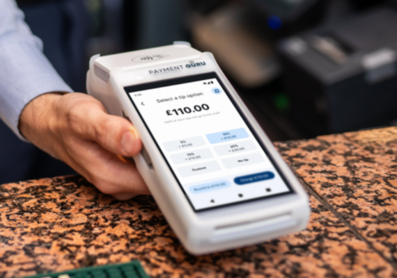 Pax A920 Card Terminal with Payment Guru branding, showing a payment screen for £100.00