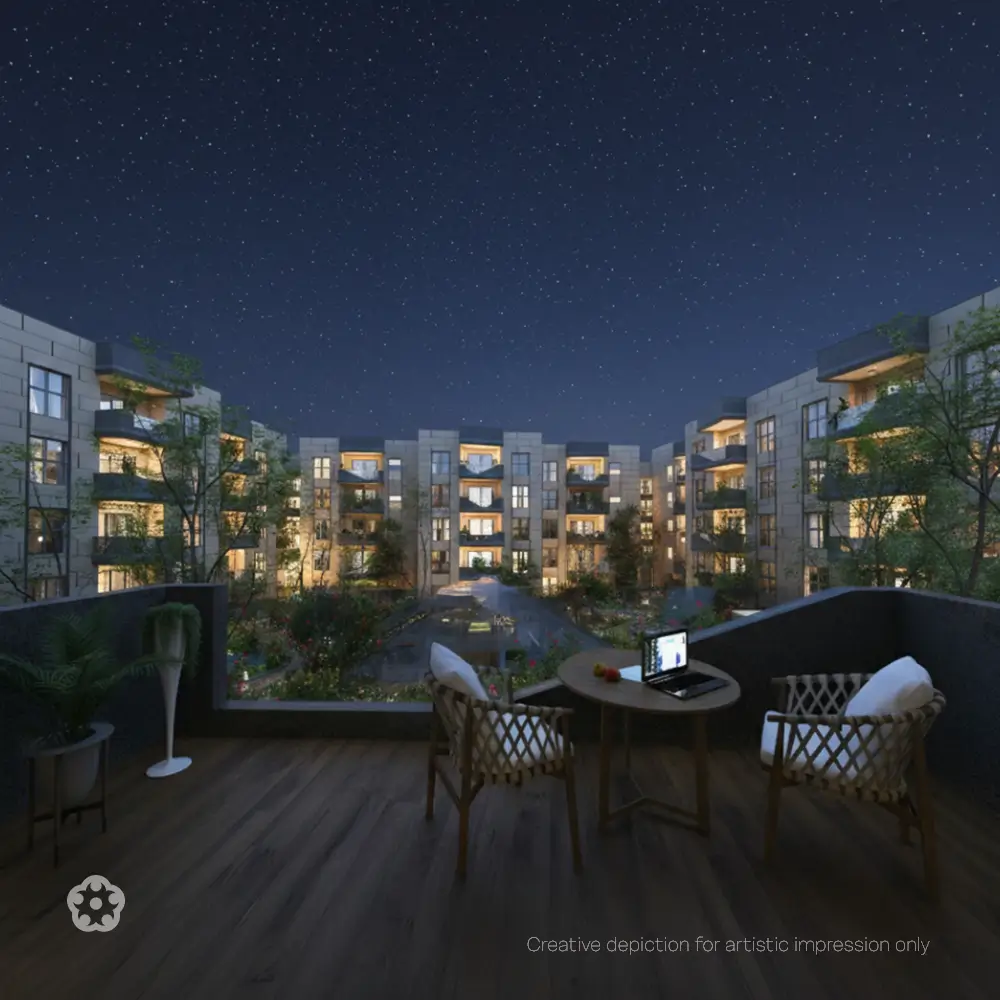 Spacious luxury apartment balcony overlooking landscaped greenery and a peaceful residential community under the night sky.