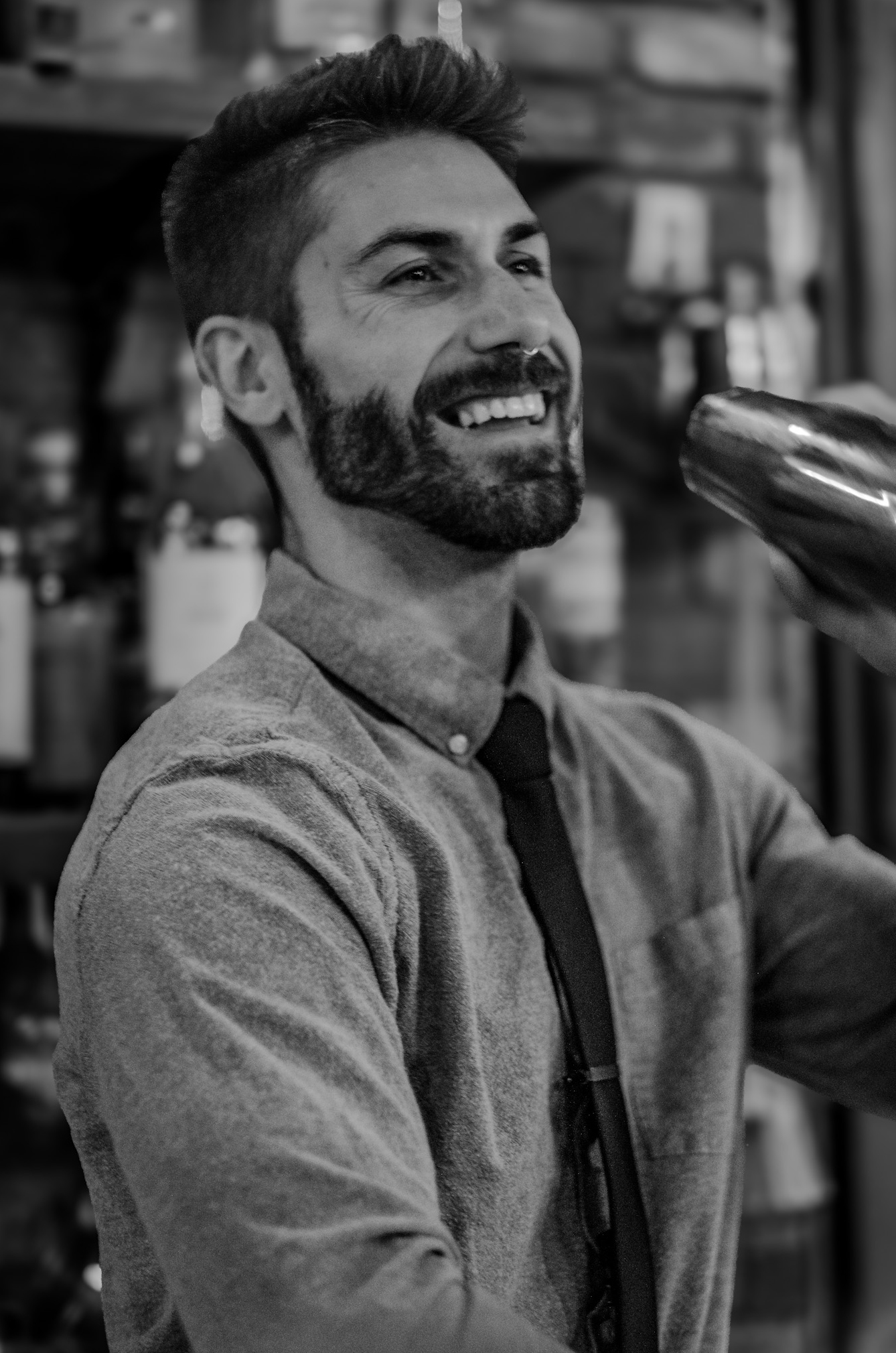 Co-owner and operator, Matt Moss shaking a drink in a tumbler