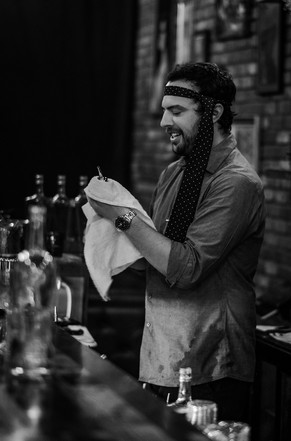The senior "taste-czar" Jordan Black dressed up and making a drink