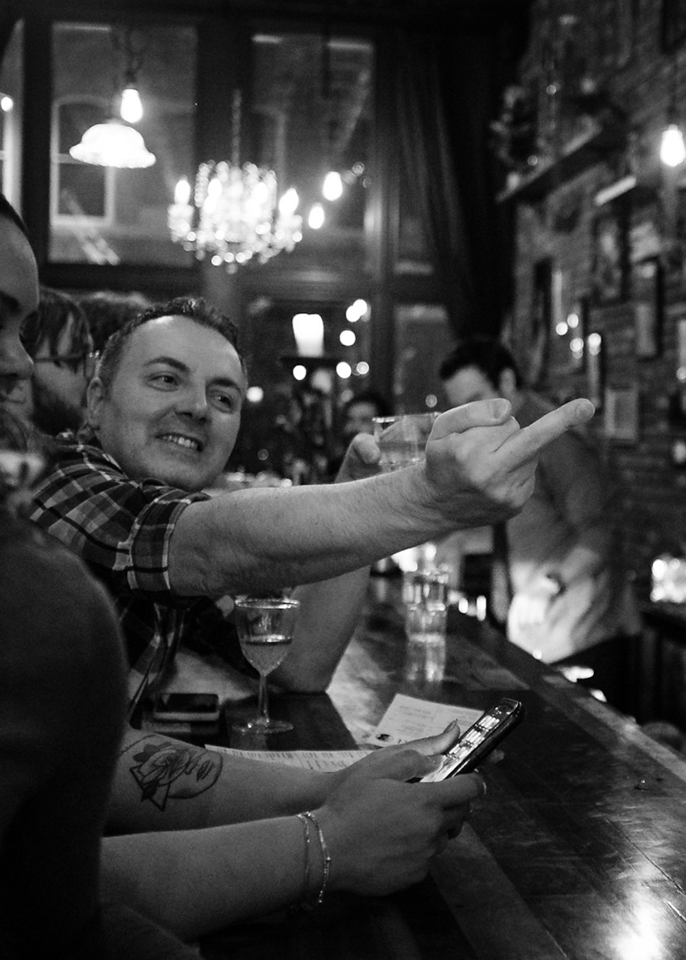 One of the regulars, Belly, smiling and giving sass to the bar staff