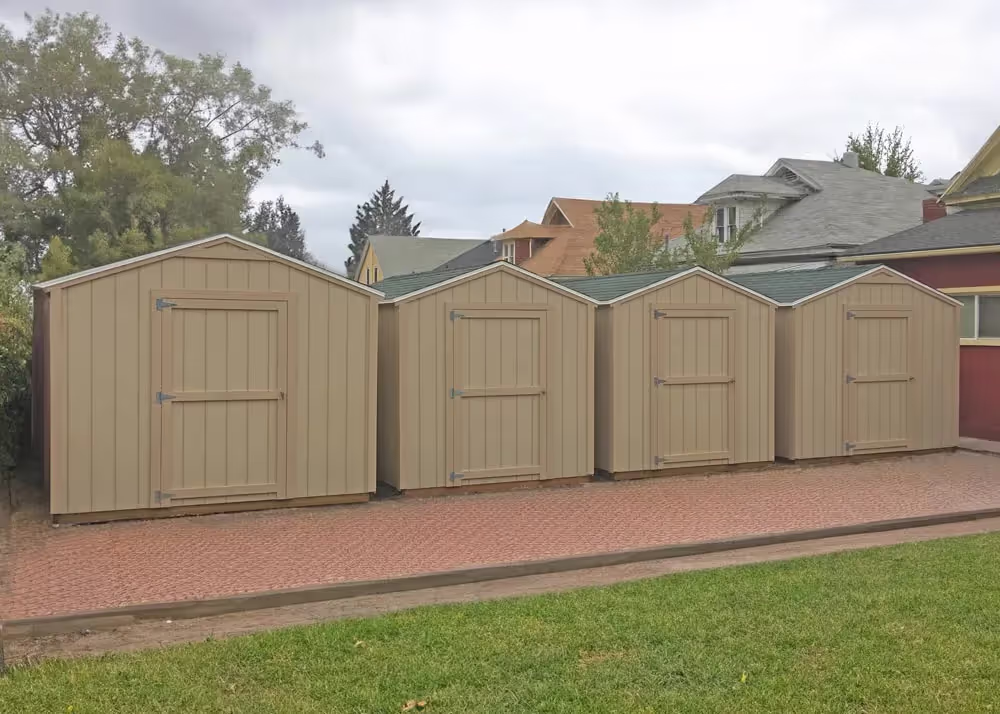 4 standard apex sheds lined up in a row