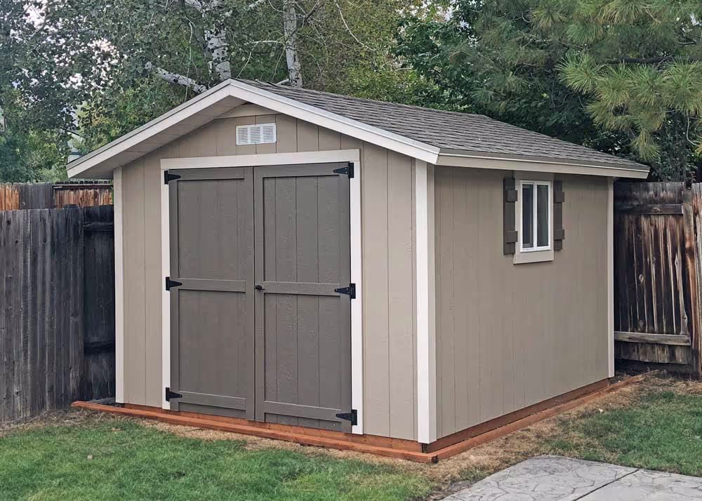 A 10 foot by 14 foot standard apex shed with three tone paint and 12" overhang