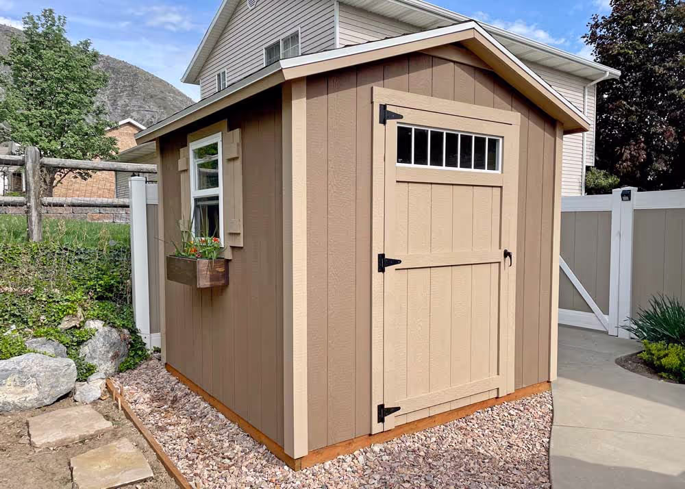 A cute 8 by 10 standard apex shed with 6" overhang and a transom window in the door